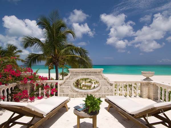 Sea View The Amazing Sea View Enjoyed From The Coral House On Grace Bay Sun Room Area With A Couple Of Lounge With Table Architecture  Luminous Private Beach House With Stylish And Chic Exotic Interiors