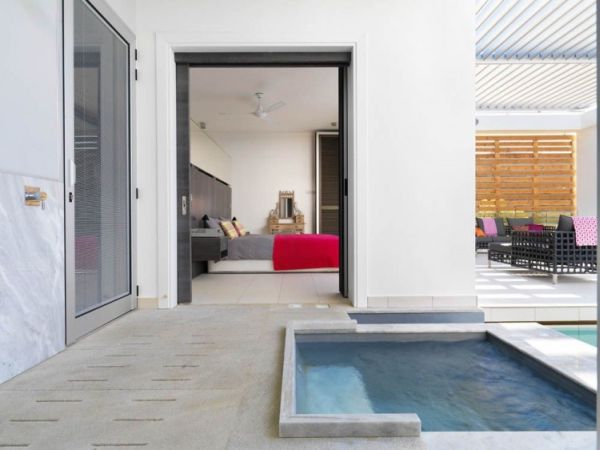 Bedroom In Home Appealing Bedroom In The Vacation Home Transformed With White Bed And Red Quilt Under The White Propeller Dream Homes Breathtaking Modern Villa With Beautiful Patio And Wonderful Swimming Pool