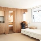 Hidden Shelves Cabin Appealing Hidden Shelves In The Cabin House With White Benches And Wooden Wall And White Ceiling Interior Design Stylish And Contemporary Cabin Interior For Your Family