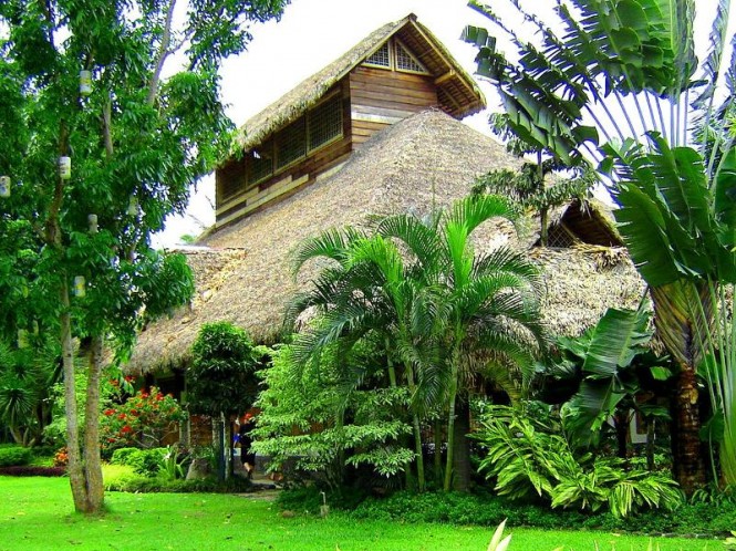 Villa Escudero Two Astonishing Villa Escudero Resort Including Two Story House Building Construction With Straw Roof Design Located In Grass Field And Forrest Views Restaurant Unique Villa Design Providing Stunning Unusual Experience