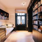 Home Office Scandinavian Attractive Home Office In The Scandinavian Apartment Stockholm With Dark Desk And Black Bookshelves Near Cozy Daybed Interior Design Excellent Cozy Interior Using Wooden Construction Domination