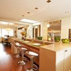 Laminate Floors Kitchen Attractive Laminate Floors In The Kitchen Decorating Ideas With Shiny Cream Kitchen Islands And Cabinetry Included Stainless Steel Bar Stools Interior Design Dazzling Wooden Floor Design For Shiny And Eco Friendly Interior