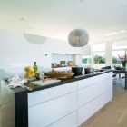 White Black With Attractive White Black Kitchen Island With Modular Pendant On White Ceiling Of Villa G By Saunders Architecture And Fruits Bowl On It Hotels & Resorts Extraordinary Modern Villa Style With Dynamic Indoor Outdoors