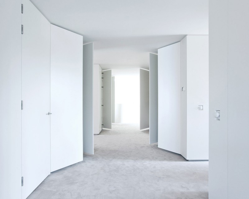 Corridor In L Awesome Corridor In The Villa L With White Doors And Grey Floor Under The White Ceiling Dream Homes Stunning Duplex Modern House Surrounded By Green Tree And Lawn Made From Concrete Material