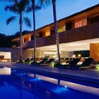 Swimming Pool Shape Beautiful Swimming Pool In Rectangle Shape Design With Coconut Trees Planted Beside The Pool In Laranjeiras House By Marcio Kogan Decoration Stunning Waterfront Villa Design Surrounded By Lot Of Beautiful Trees