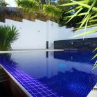 Modern Hitech Pool Bluish Modern Hitech Mansion Infinity Pool Design Applied On The Outdoor Backyard And Surrounded With Shady Ornamental Plantation Interior Design Beautiful Interior Design In Modern Hi-Tech Mansion House Of Paddington