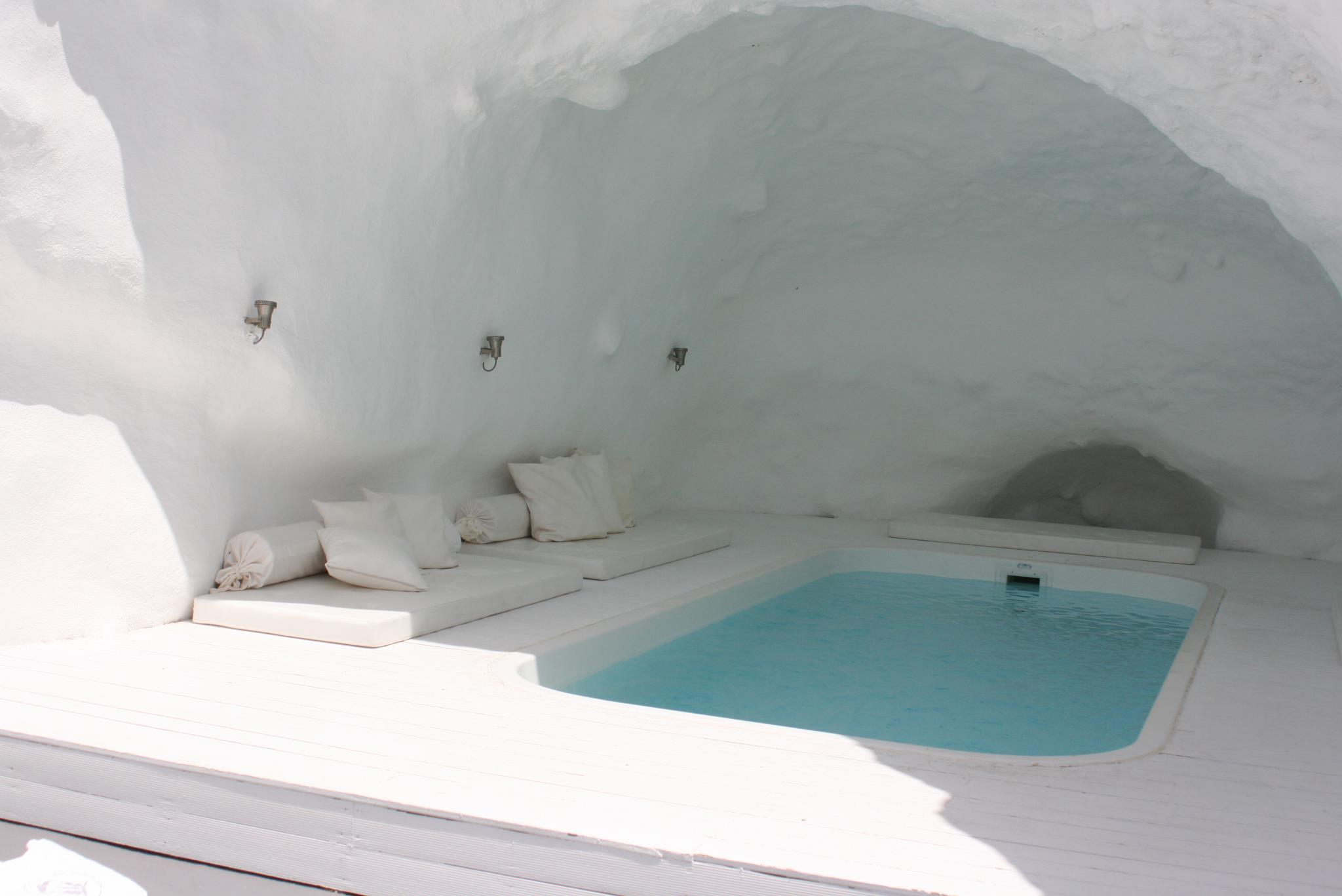 Indoor Pool Katikies Brilliant Indoor Pool Design At Katikies Hotels In Oia With Floor Bed Seems Like Inside The Cave Plus Wall Lamp Interior Design Classy And Elegant White Home With Breathtaking Panoramic Sea Views