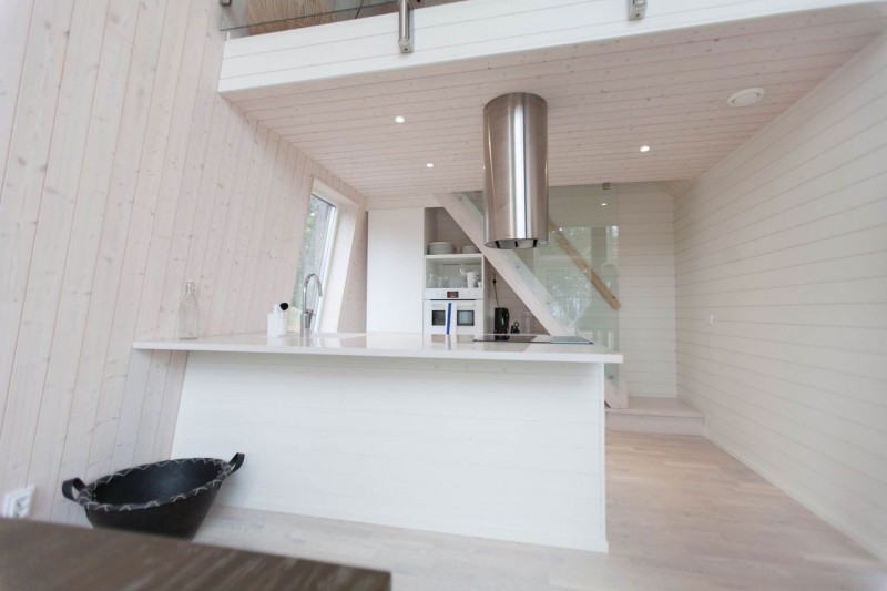 White Island Iron Charming White Island And Curved Iron Faucet For Kitchen In Chalet Lagunen Residence Beautified With Decorative Basket Dream Homes  Luminous And Shining House With Contemporary Yet Balanced Color Palette