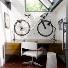 Design Of Home Chummy Design Of Space Conscious Home Office With Sloped Windows And A Bicycle Mounted On The Wall And Opened Window Office & Workspace Elegant And Modern Home Office Design For A Stylish Working Space