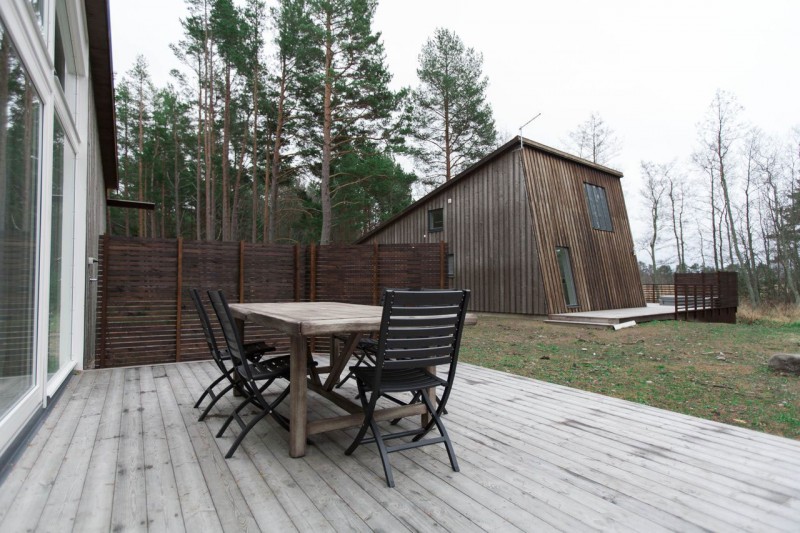 Wooden Desk Wooden Classic Wooden Desk And Black Wooden Single Chairs For Living Room Outside The House Of Chalet Lagunen Residence Dream Homes  Luminous And Shining House With Contemporary Yet Balanced Color Palette