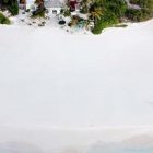 White View Sand Clear White View Of Beach Sand Found In Front Of The Coral House On Grace Bay Building With Lush Vegetation Architecture Luminous Private Beach House With Stylish And Chic Exotic Interiors