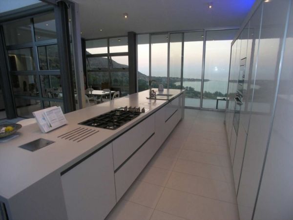 Kitchen In Home Cozy Kitchen In The Vacation Home Transformed With Long Island And White Cabinets Near Glass Walls Dream Homes Breathtaking Modern Villa With Beautiful Patio And Wonderful Swimming Pool