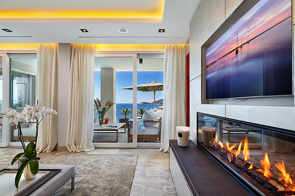 Living Room Fireplace Cozy Living Room With Modern Fireplace At Mallorca Villa Applied Hidden LED Ceiling Lamp And Metal Vase Dream Homes Luxurious Contemporary Mediterranean Villa With Sophisticated Interior Style