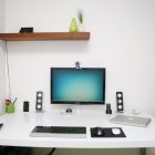 Work Space A Excellent Work Space Design Including A PC Setup On The White Desk Beside A Flat Screen TV Attached On The White Painted Wall Decoration Office & Workspace Stunning Cool Workspace Designs For Your Cozy Office Room
