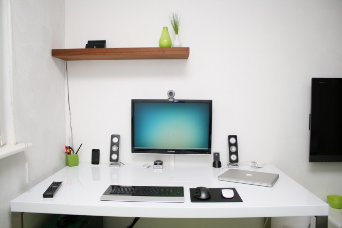 Work Space A Excellent Work Space Design Including A PC Setup On The White Desk Beside A Flat Screen TV Attached On The White Painted Wall Decoration Office & Workspace Stunning Cool Workspace Designs For Your Cozy Office Room