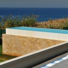 Beach Panorama On Extraordinary Beach Panorama And Shrubs On Wide Courtyard Solid Concrete Floor Excellent Infinity Pool Fidar Beach House Dream Homes Futuristic Modern Beach House With Neutral Color Palettes For A Family Of Five