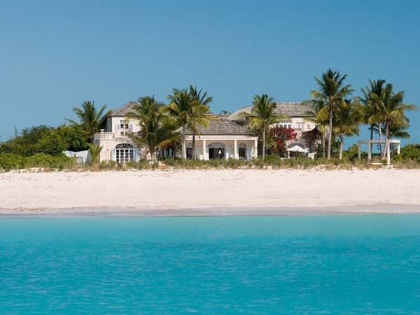 Catching White House Eye Catching White The Coral House On Grace Bay Building Seen From Sea With White Sandy Ground And Palm Trees Architecture  Luminous Private Beach House With Stylish And Chic Exotic Interiors