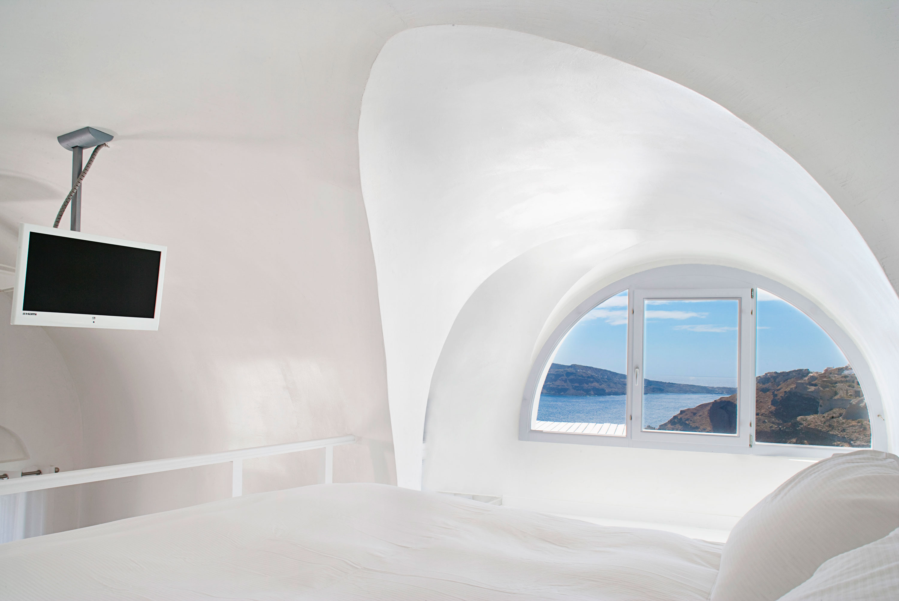 Bedroom Design Katikies Fabulous Bedroom Design Inside The Katikies Hotels In Oia Applied Hanging TV Ideas And All White Painted Wall Interior Design  Classy And Elegant White Home With Breathtaking Panoramic Sea Views