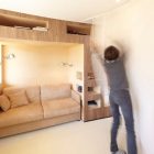 Bookshelves In House Fabulous Bookshelves In The Cabin House Kids Bedroom With Brown Sofa And Wooden Wall Under White Ceiling Interior Design Stylish And Contemporary Cabin Interior For Your Family