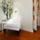 White Armchair Botanist Fancy White Armchair At Corner Botanist Suite I3 Design Group With Indoor Planter With White Side Table Interior Design Elegant Botanical Interior Decoration Within Contemporary Modern Apartment