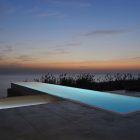Sunset And Modern Fantastic Sunset And Ocean View Modern Infinity Pool With Shiny Pool Light Concrete Floor Leafy Shrubs On Wide Yard Fidar Beach House Dream Homes Futuristic Modern Beach House With Neutral Color Palettes For A Family Of Five
