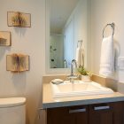 Powder Room Wall Fascinating Powder Room With Framed Wall Mirror And Wooden Vanity At Botanist Suite I3 Design Group With Towel Ring Interior Design Elegant Botanical Interior Decoration Within Contemporary Modern Apartment