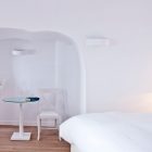 Reading Nook Katikies Fascinating Reading Nook Design At Katikies Hotels In Oia With Circular Table And White Upholstered Chair Beside It Interior Design Classy And Elegant White Home With Breathtaking Panoramic Sea Views