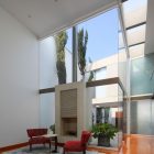 Red Chairs Fireplace Gorgeous Red Chairs And Concrete Fireplace In The Patio Residence With Grey Rug And Hardwood Floor Dream Homes Stunning White Home With Authentic Patio In Modern Style