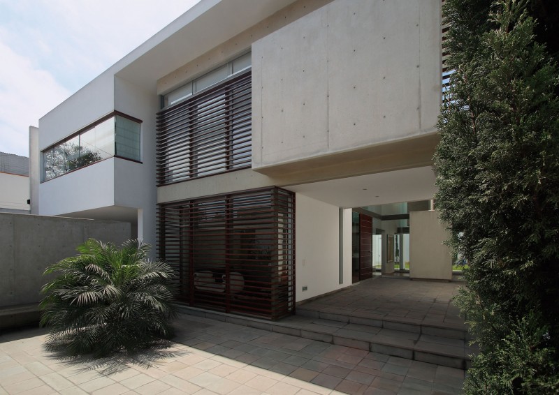 Wooden Shutters Wall Innovative Wooden Shutters And Concrete Wall In The Patio Residence Facade With Green Plantations And Stone Floor Dream Homes  Stunning White Home With Authentic Patio In Modern Style