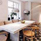 Granite Table Scandinavian Long Granite Table In The Scandinavian Apartment Stockholm Dining Space With Rattan Chairs And White Bay Seats Window Interior Design Excellent Cozy Interior Using Wooden Construction Domination