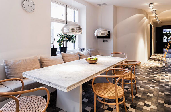 Granite Table Scandinavian Long Granite Table In The Scandinavian Apartment Stockholm Dining Space With Rattan Chairs And White Bay Seats Window Interior Design  Excellent Cozy Interior Using Wooden Construction Domination
