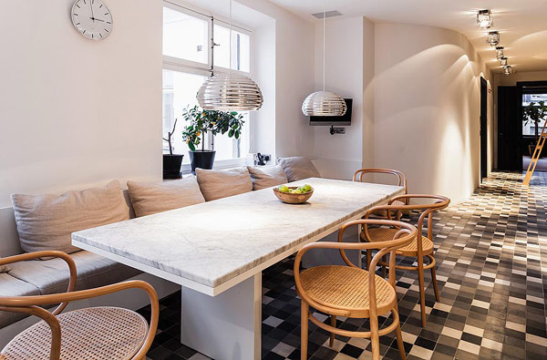 Granite Table Scandinavian Long Granite Table In The Scandinavian Apartment Stockholm Dining Space With Rattan Chairs And White Bay Seats Window Interior Design Excellent Cozy Interior Using Wooden Construction Domination