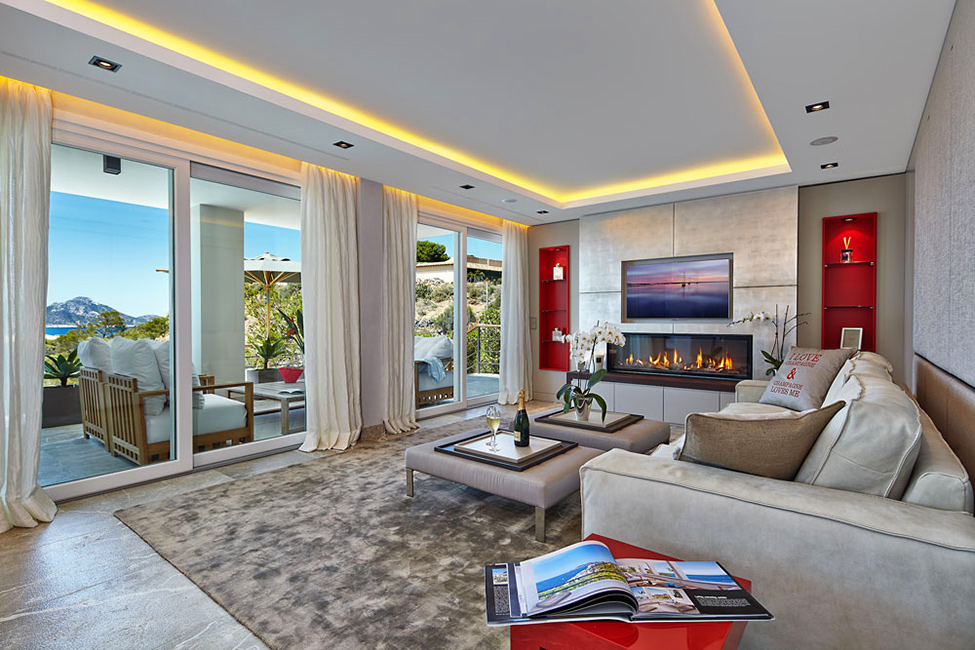 Living Room The Marvelous Living Room Design Inside The Mallorca Villa With Beige Sofa And Red Side Table On Carpet Area Dream Homes Luxurious Contemporary Mediterranean Villa With Sophisticated Interior Style