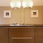 Cooktop On Island Metal Cooktop On Golden Kitchen Island Enlightened By Classy Pendant Lamps In Elegant Kitchen Of Contemporary Wilton Place Townhouse Interior Design Classic Contemporary Townhouse With Blend Interior Design Style 