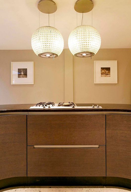 Cooktop On Island Metal Cooktop On Golden Kitchen Island Enlightened By Classy Pendant Lamps In Elegant Kitchen Of Contemporary Wilton Place Townhouse Interior Design Classic Contemporary Townhouse With Blend Interior Design Style 