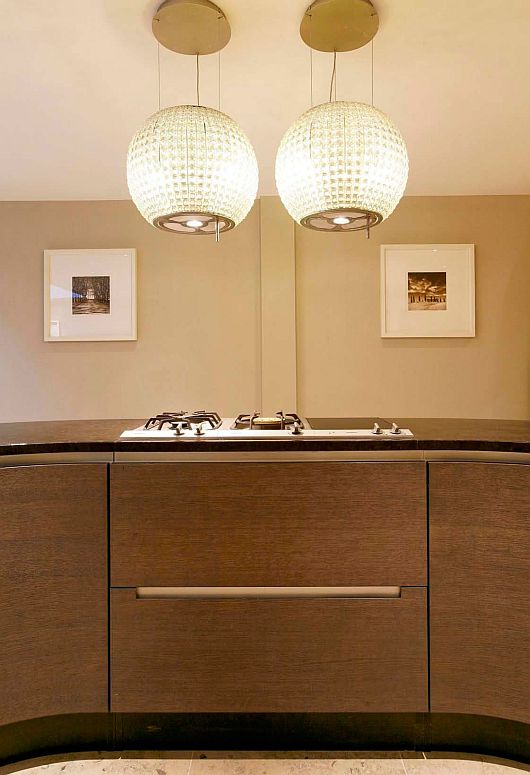 Cooktop On Island Metal Cooktop On Golden Kitchen Island Enlightened By Classy Pendant Lamps In Elegant Kitchen Of Contemporary Wilton Place Townhouse Interior Design  Classic Contemporary Townhouse With Blend Interior Design Style 