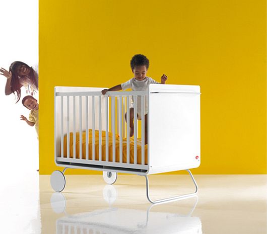 Crib Nursery With Minimalist Crib Nursery Furniture Design With White Banister And Steel Wheels Equipped With Yellow Bed Cover For Baby Girl Kids Room  Creative Kids Bedroom Decorated With Cheerful And Playful Themes