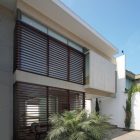 Details In Residence Minimalist Details In The Patio Residence Exterior With Wooden Shutters And White Ceiling Above Stone Floor Dream Homes Stunning White Home With Authentic Patio In Modern Style