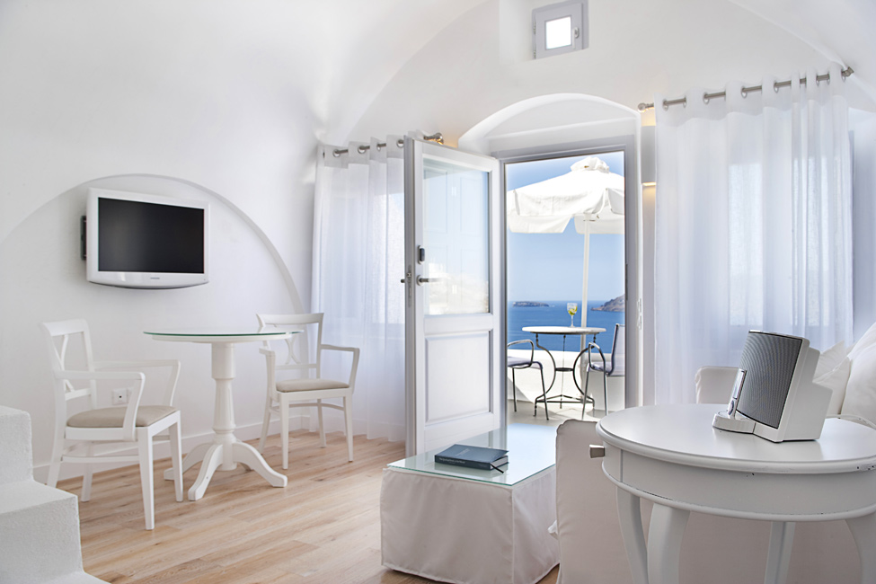 Design Of At Modern Design Of Family Room At Katikies Hotels In Oia With Glass Top Table And White Transparent Curtain Design Interior Design Classy And Elegant White Home With Breathtaking Panoramic Sea Views