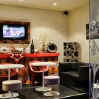Room Decor Cafe Playful Room Decor Inside Scarlett Cafe Restaurant Design With Fashionable Black Sofa And Colorful Patterned Bar With TV Holder Interior Design Stunning Modern Interior Design In Scarlett Cafe & Restaurant (+6 New Images)
