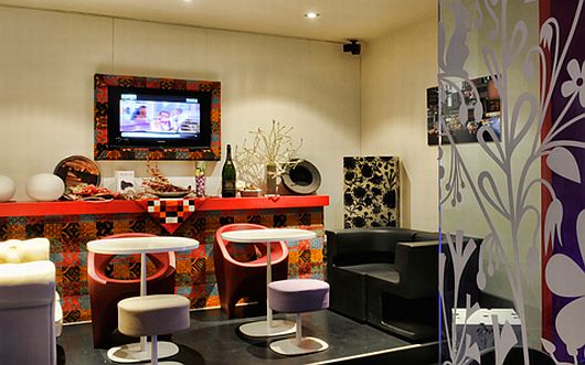 Room Decor Cafe Playful Room Decor Inside Scarlett Cafe Restaurant Design With Fashionable Black Sofa And Colorful Patterned Bar With TV Holder Interior Design Stunning Modern Interior Design In Scarlett Cafe & Restaurant
