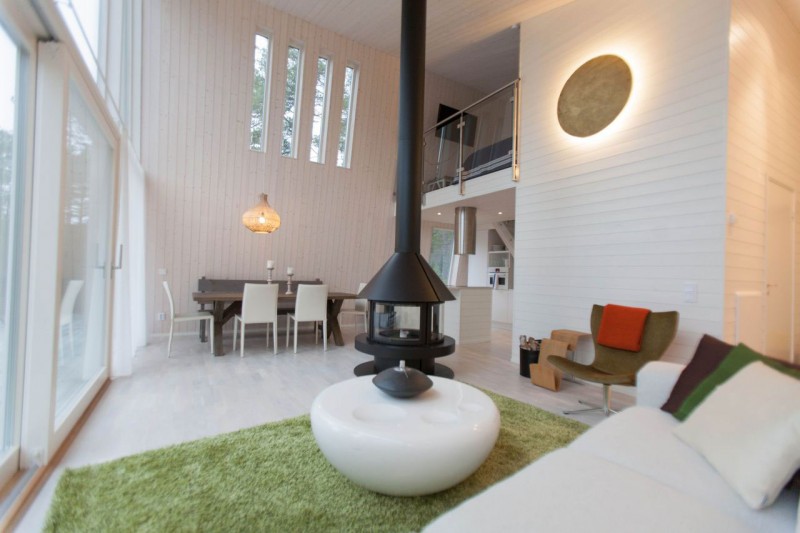 Green White The Refreshing Green White Carpet In The Living Room Of Chalet Lagunen Residence With Decorative Single Chair And White Round Table Dream Homes Luminous And Shining House With Contemporary Yet Balanced Color Palette