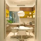 Cream Nuance Office Remarkable Cream Nuance Of Home Office Space For Entire Family With Warm Hues And Translucent Doors Included Yellow Backsplash And Great Chandelier Office & Workspace Elegant And Modern Home Office Design For A Stylish Working Space