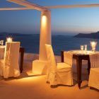 Outdoor Dining Katikies Romantic Outdoor Dining Area At Katikies Hotels In Oia With Dramatic Lighting Decorated Wit Fabric White Chairs Interior Design Classy And Elegant White Home With Breathtaking Panoramic Sea Views