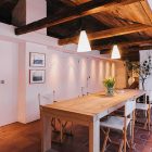 Wooden Dining The Rustic Wooden Dining Table In The Scandinavian Apartment Stockholm With Interesting Chairs Under The Bright Lamps Interior Design Excellent Cozy Interior Using Wooden Construction Domination