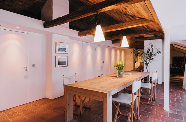 Wooden Dining The Rustic Wooden Dining Table In The Scandinavian Apartment Stockholm With Interesting Chairs Under The Bright Lamps Interior Design  Excellent Cozy Interior Using Wooden Construction Domination