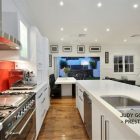 Modern Hitech Space Stylish Modern Hitech Mansion Kitchen Space Designed With Bright Red Kitchen Backsplash On Clear White Kitchen Cabinet Interior Design Beautiful Interior Design In Modern Hi-Tech Mansion House Of Paddington