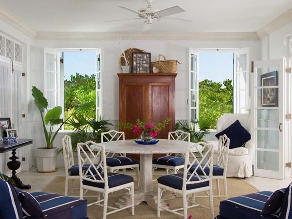 The Coral Grace Stylish The Coral House On Grace Bay Dining Room Idea Furnished With Navy Chairs Surrounding Round Table Office & Workspace Luminous Private Beach House With Stylish And Chic Exotic Interiors