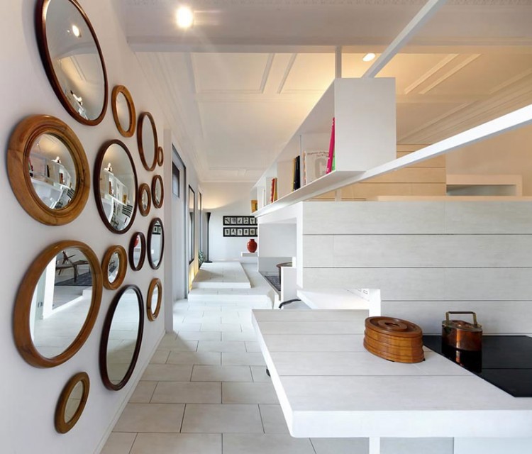 Rounded Mirrors White Unusual Rounded Mirrors On The White Wall In Ceramic House Madrid Spain With White Floor And White Bookshelves Interior Design Elegant Ceramic Interior Design With Beautiful Dining And Kitchen Partition
