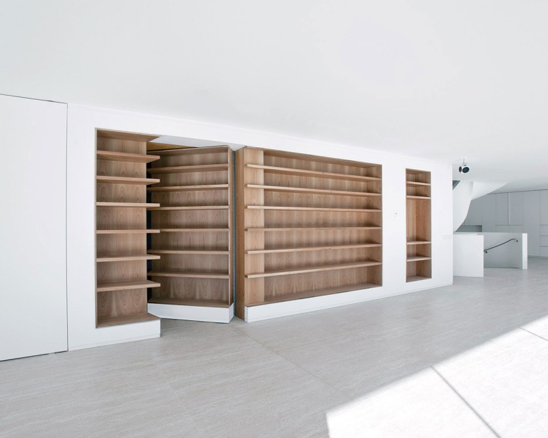 Wooden Shelves Villa Unusual Wooden Shelves In The Villa L With Hidden Door On The Hardwood Floor Under White Ceiling Dream Homes Stunning Duplex Modern House Surrounded By Green Tree And Lawn Made From Concrete Material